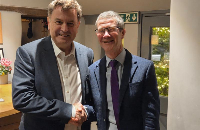 Sir Mel Stride shakes Mike Knuckey's hand