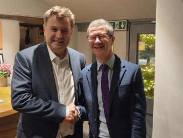 Sir Mel Stride shakes Mike Knuckey's hand